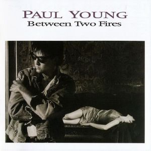 Album Paul Young - Between Two Fires